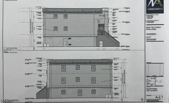 a view of staircase with white walls and cabinet