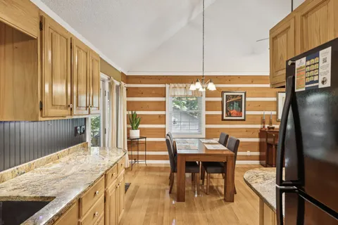 a view of kitchen with furniture and chandelier
