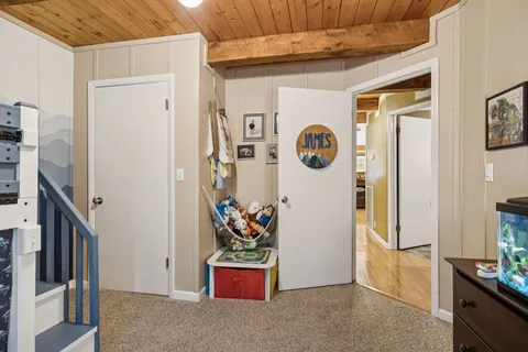 a view of an entryway with wooden floor