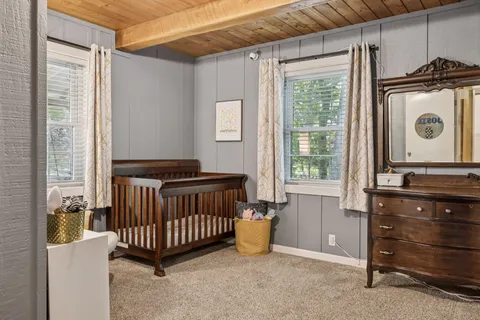 a view of a bedroom with furniture and staircase