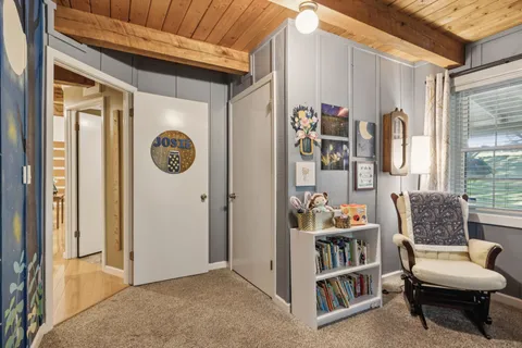 a view of a livingroom with furniture and windows