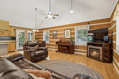 a living room with furniture and a flat screen tv