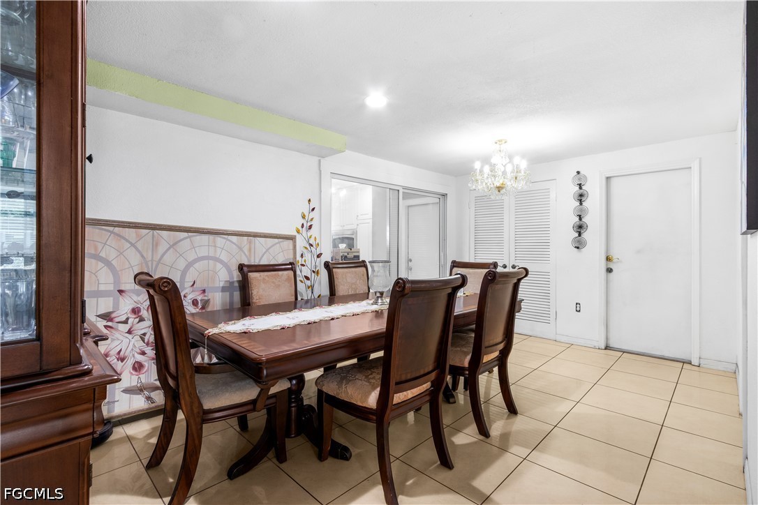 18 Illinois Road Lehigh Acres, FL 33936 - Photo 13 of 45 a view of a dining room with furniture