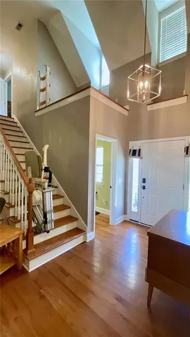 a view of a fireplace window and wooden floor