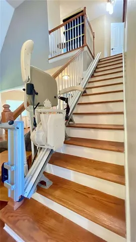 a bedroom with a bed chair and a window