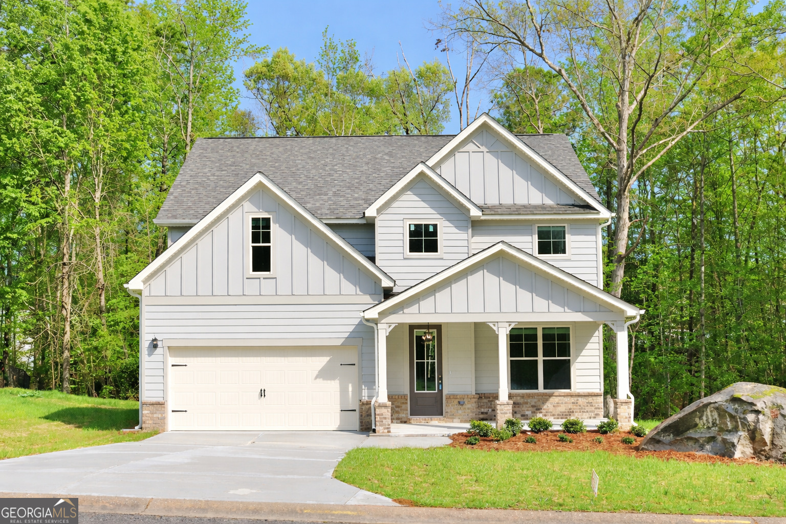 1023 Boulder Drive Gray, GA 31032 - Photo 1 of 52 a front view of a house with a yard and garage