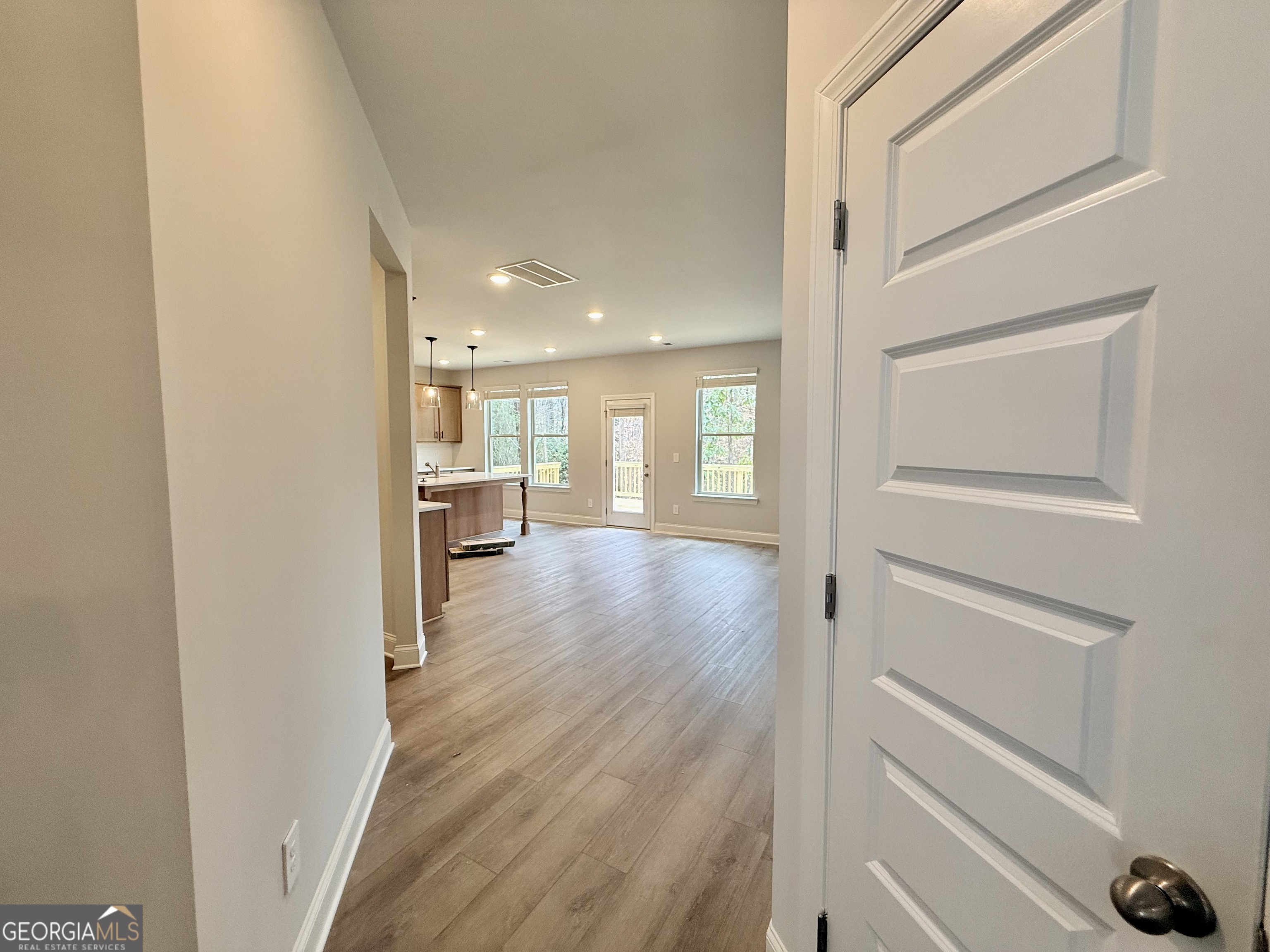1023 Boulder Drive Gray, GA 31032 - Photo 15 of 52 a view of a hallway with wooden floor and a cabinet