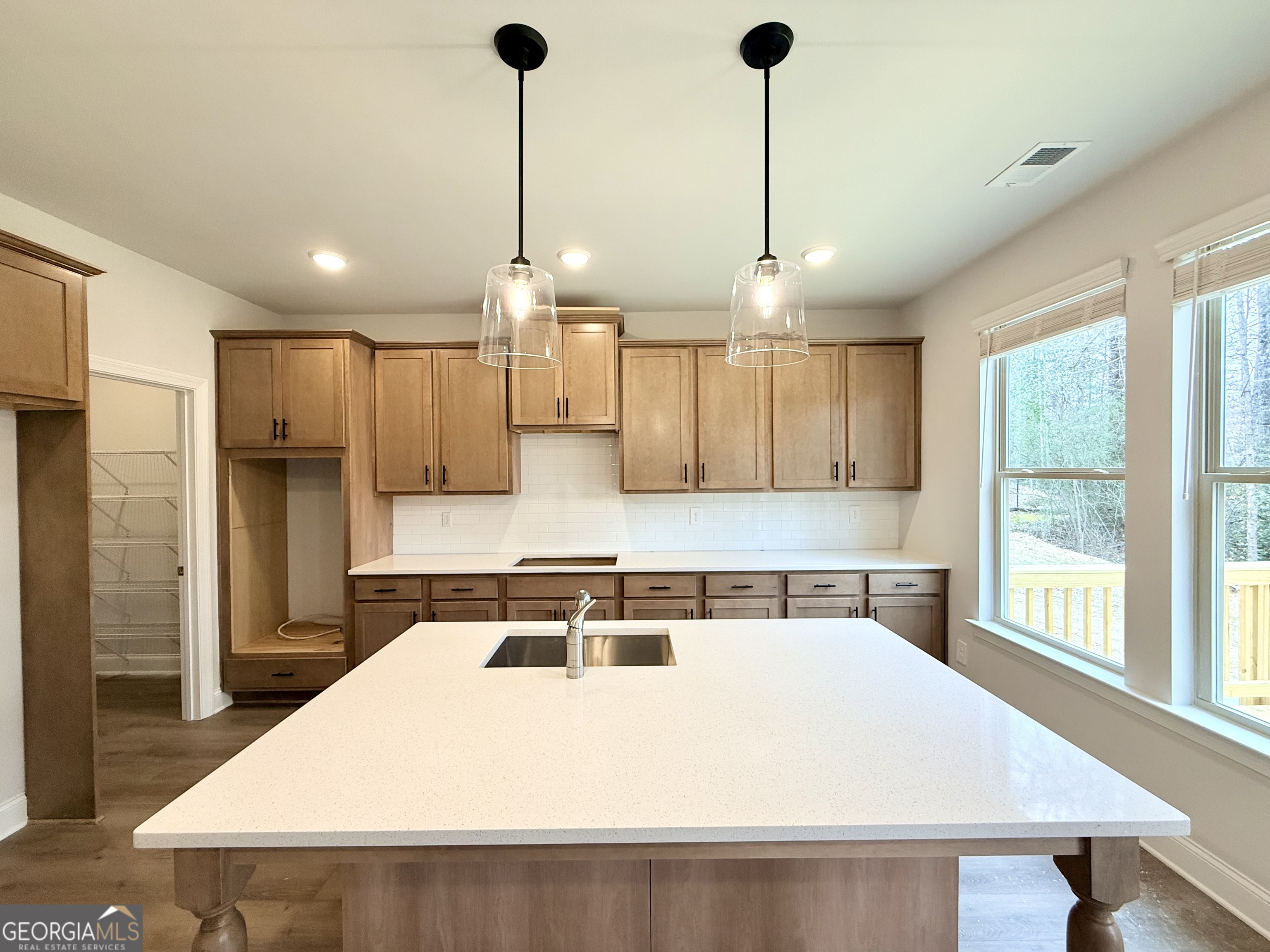 1023 Boulder Drive Gray, GA 31032 - Photo 24 of 52 a kitchen with a refrigerator a sink and wooden floor
