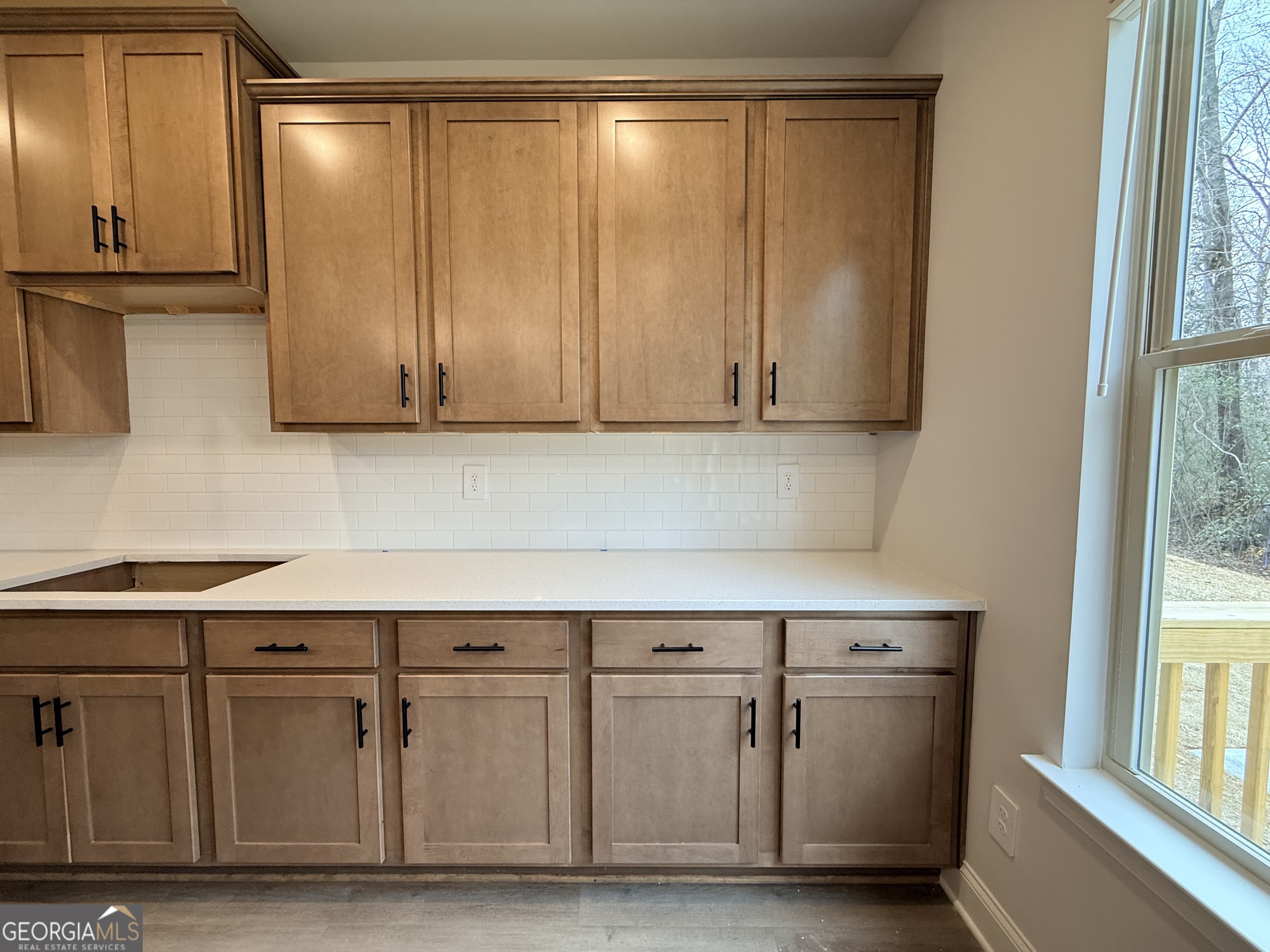 1023 Boulder Drive Gray, GA 31032 - Photo 25 of 52 a kitchen with cabinets and a wooden floors