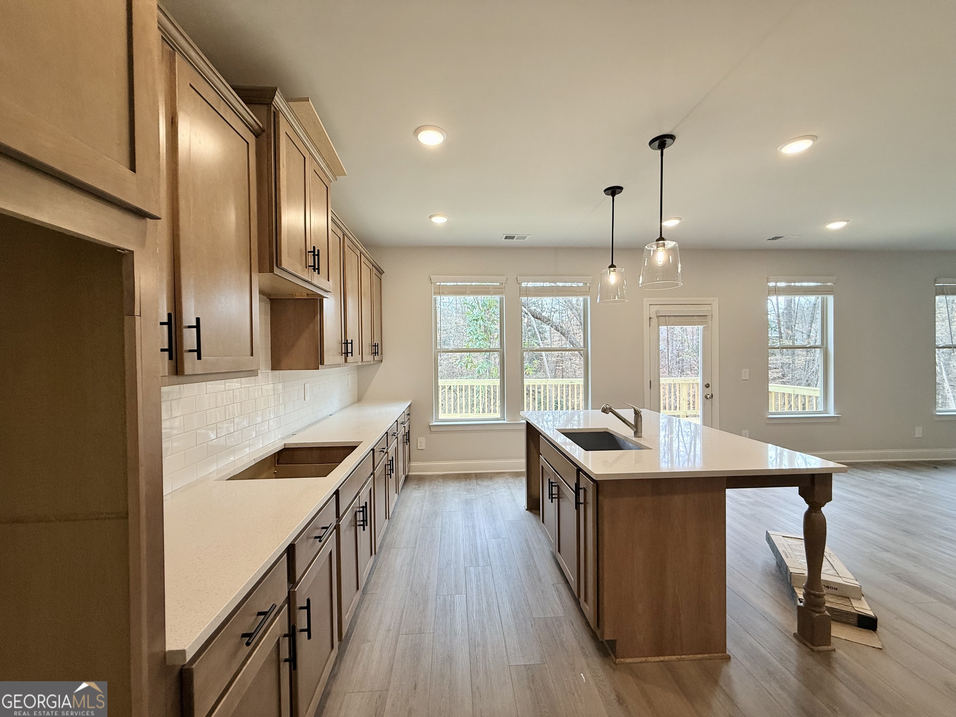 1023 Boulder Drive Gray, GA 31032 - Photo 28 of 52 a kitchen with stainless steel appliances granite countertop counter space and wooden floor
