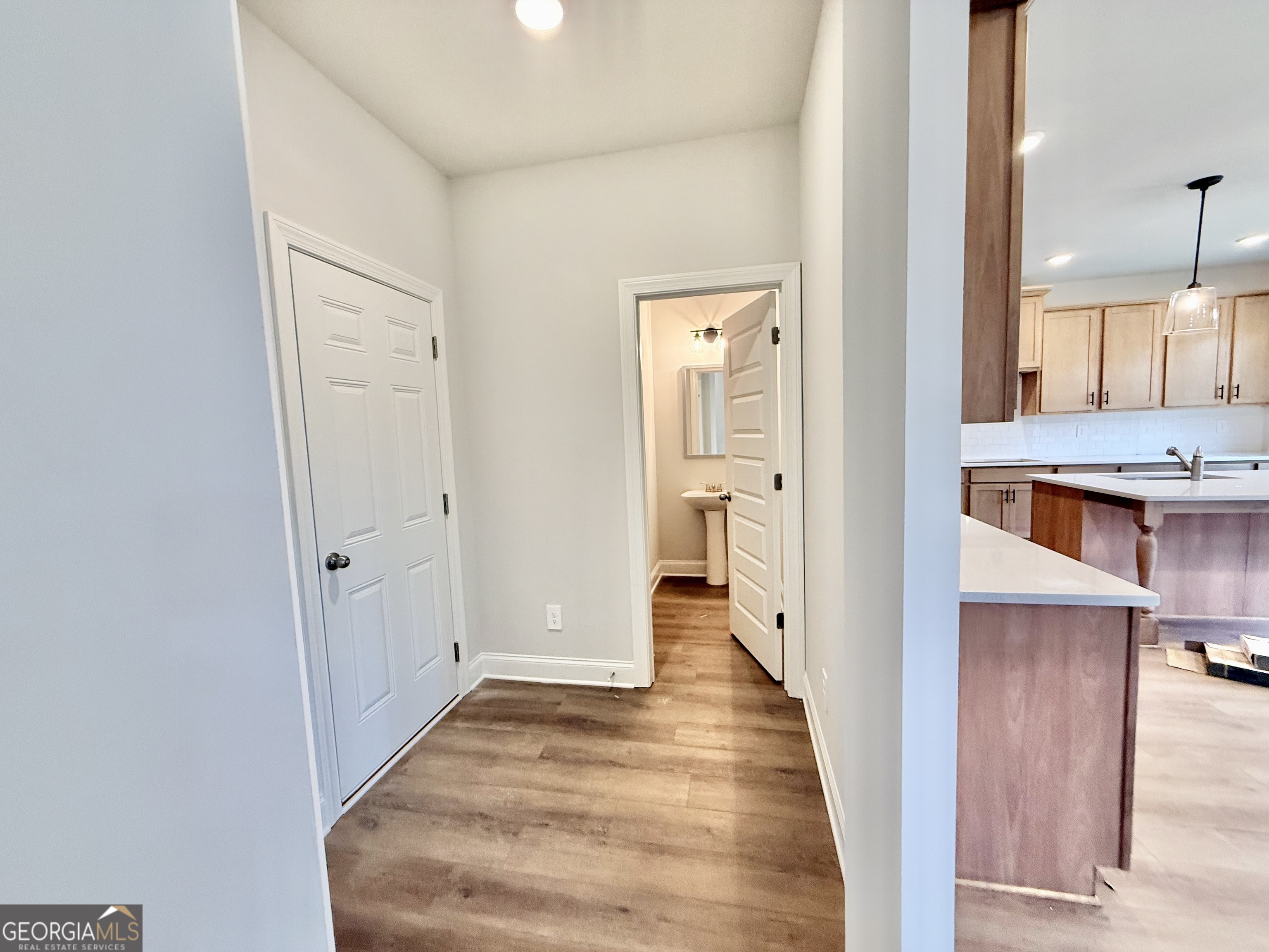1023 Boulder Drive Gray, GA 31032 - Photo 34 of 52 a view of a hallway with wooden floor and a bathroom