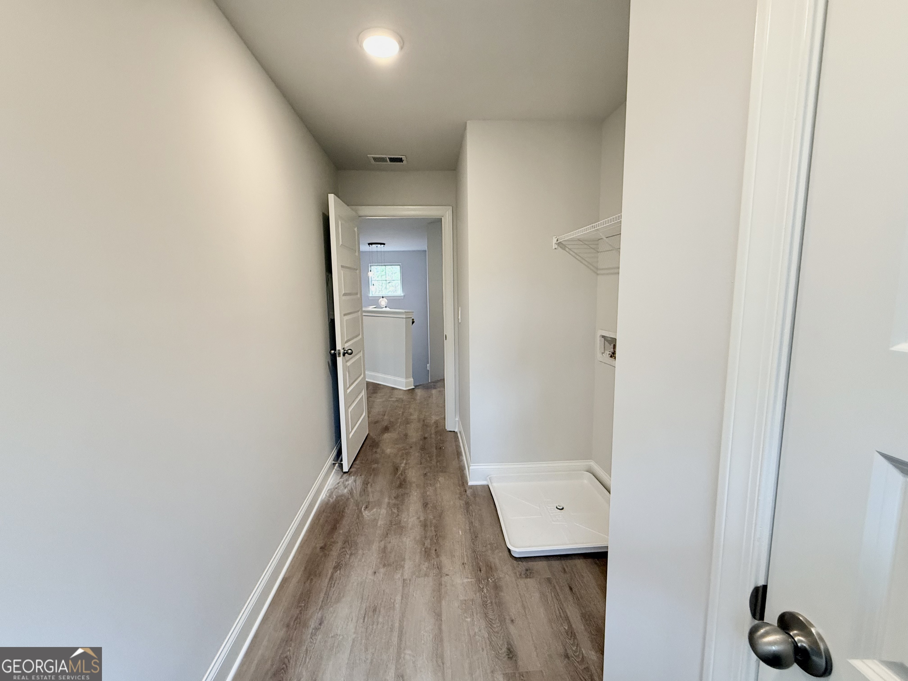 1023 Boulder Drive Gray, GA 31032 - Photo 40 of 52 a view of a hallway with wooden floor and closet