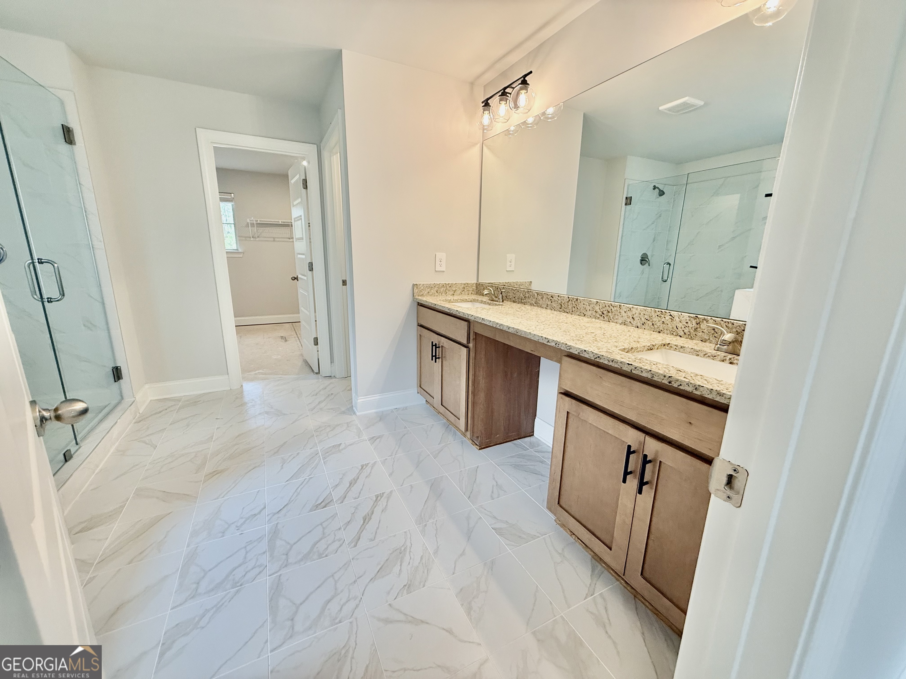 1023 Boulder Drive Gray, GA 31032 - Photo 41 of 52 a spacious bathroom with a granite countertop sink and a mirror