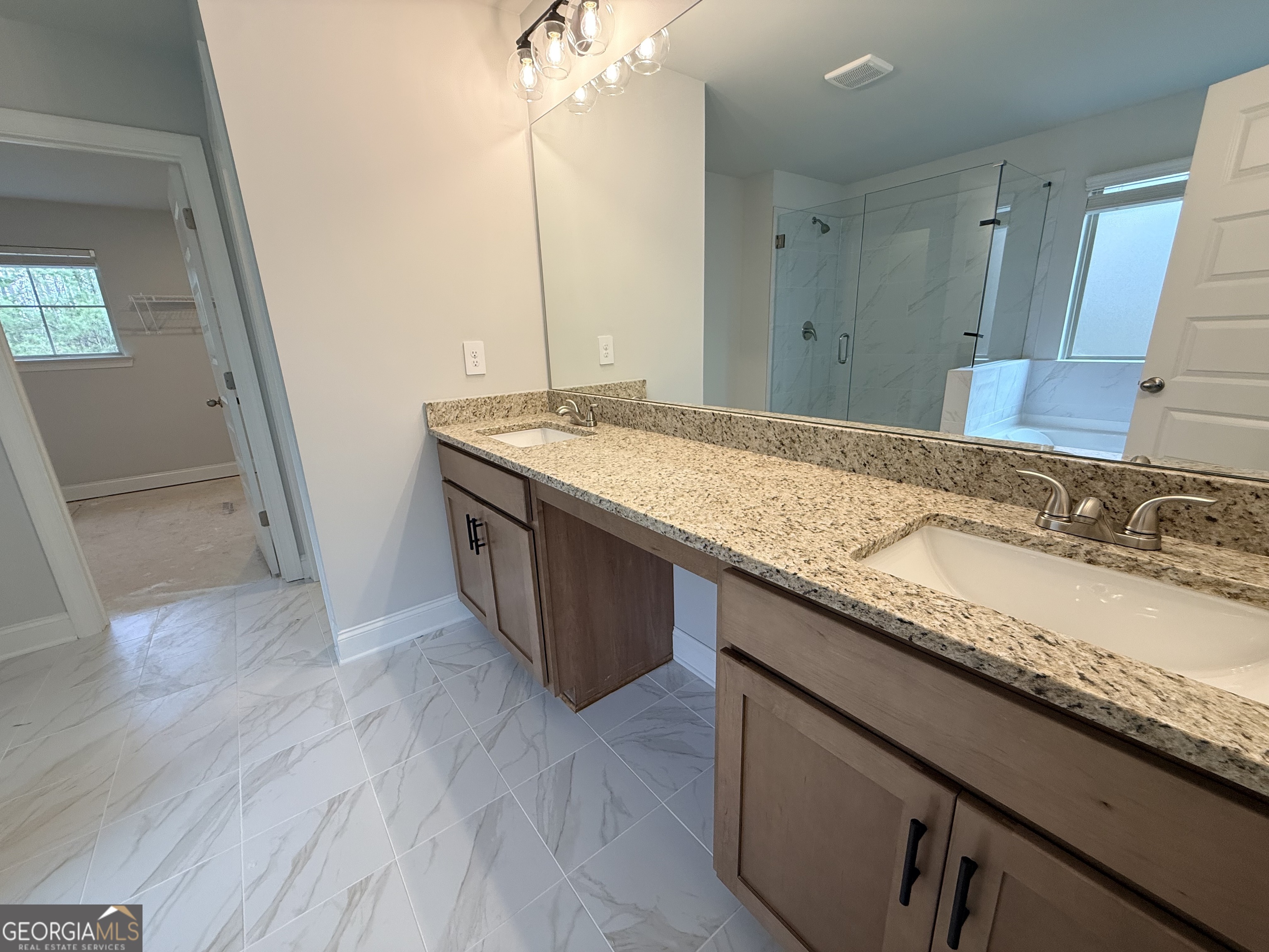 1023 Boulder Drive Gray, GA 31032 - Photo 42 of 52 a bathroom with a granite countertop sink and a mirror