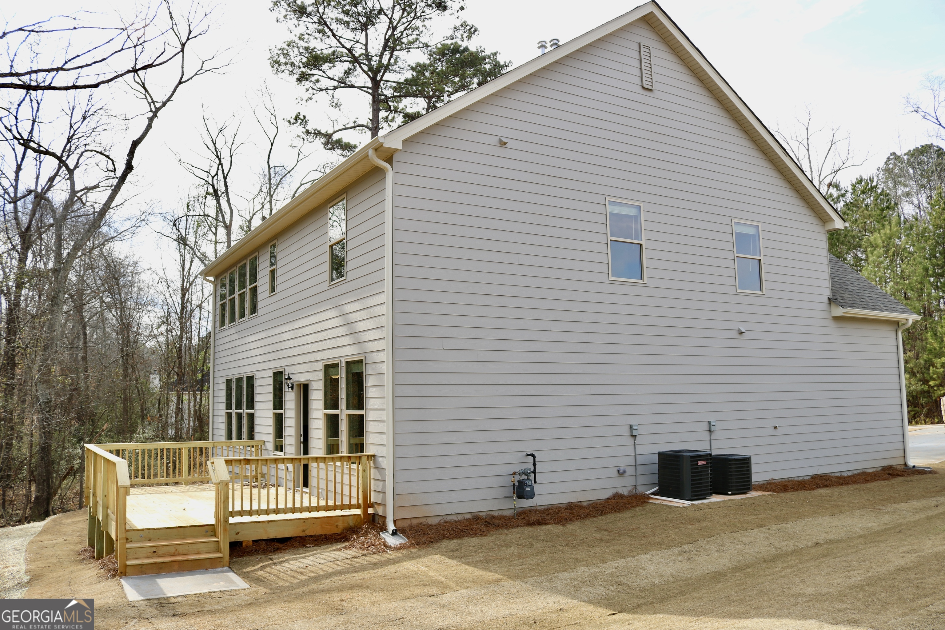 1023 Boulder Drive Gray, GA 31032 - Photo 49 of 52 a view of a white house with a large windows
