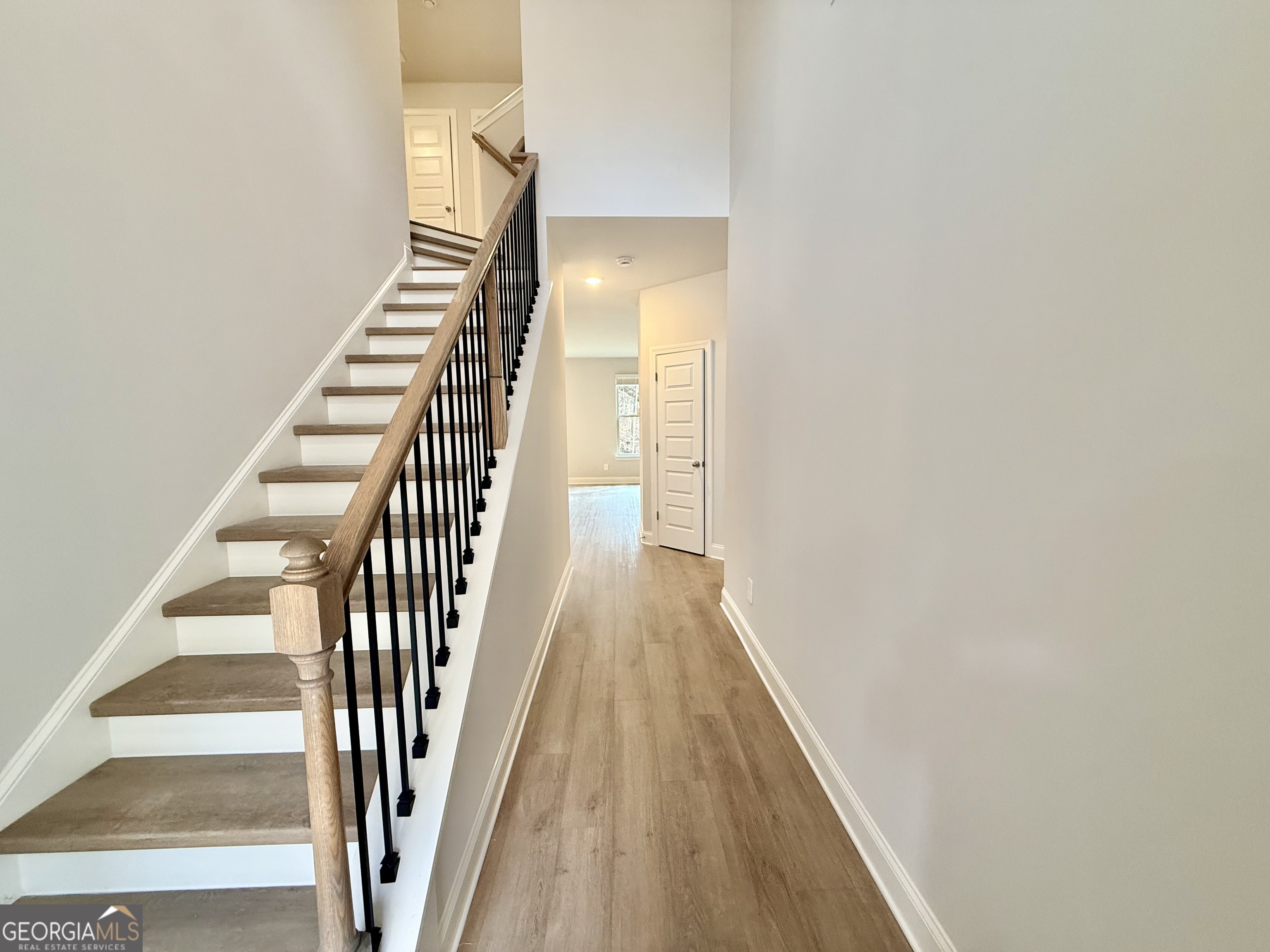 1023 Boulder Drive Gray, GA 31032 - Photo 8 of 52 a view of a hallway with wooden floor and entryway