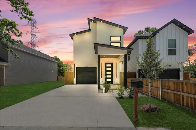 a front view of a house with yard