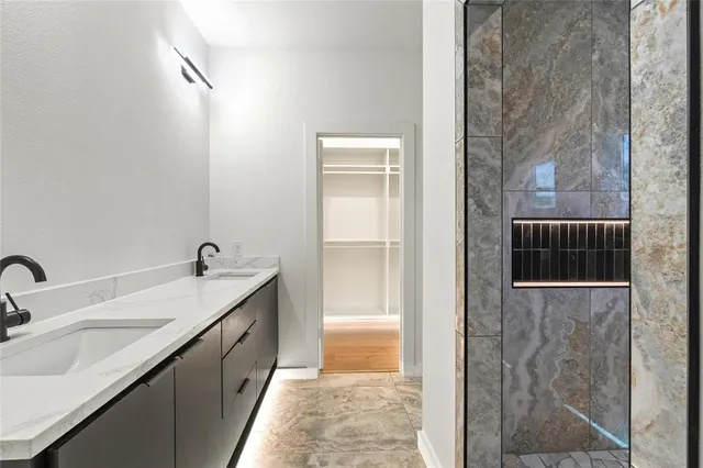 a bathroom with a sink and mirror