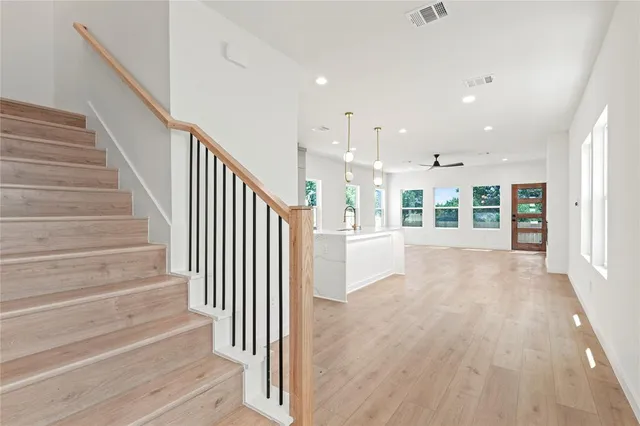 a view of an entryway with wooden floor