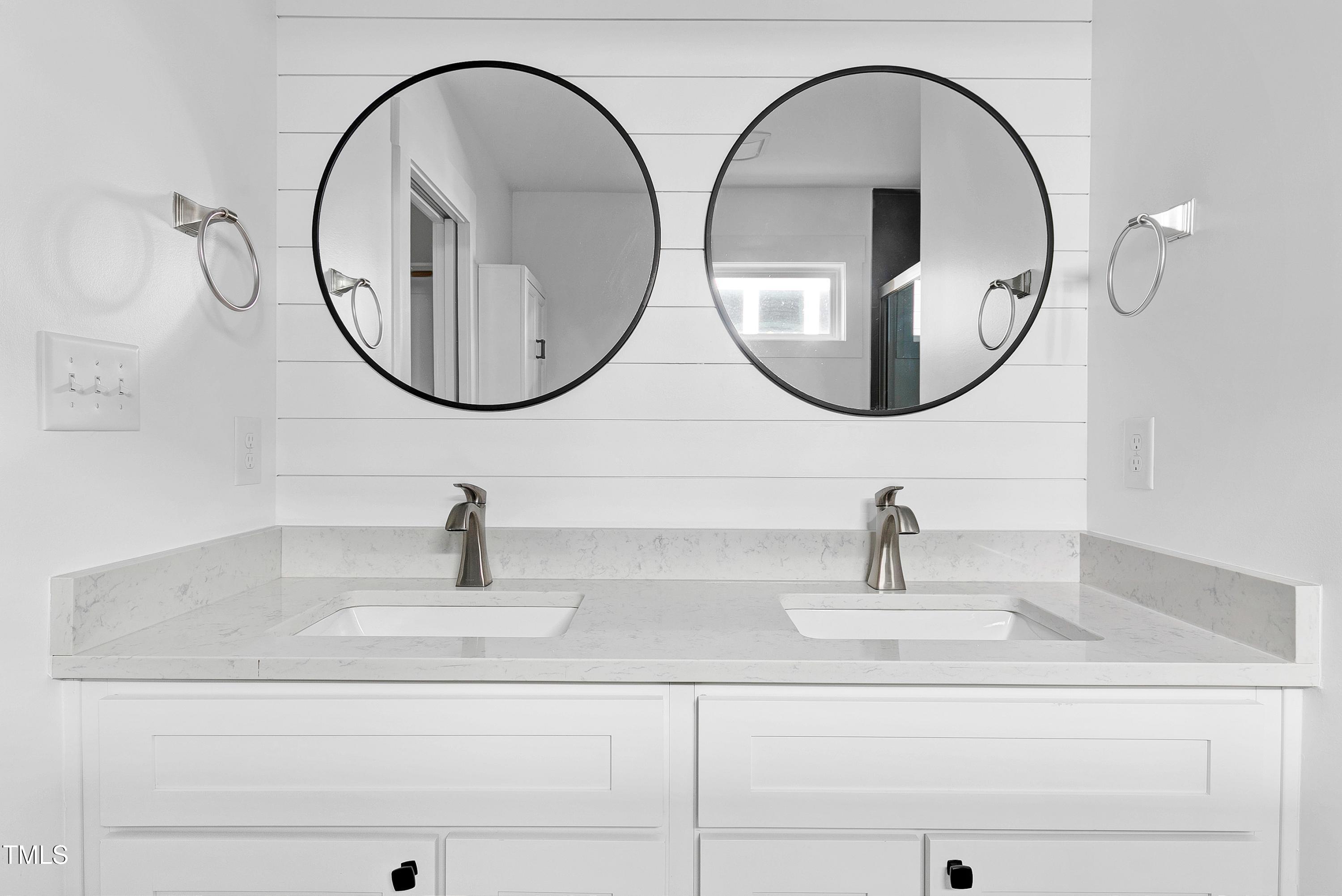 621 Coleman Street Raleigh, NC 27610 - Photo 19 of 42 a bathroom with a sink and a mirror