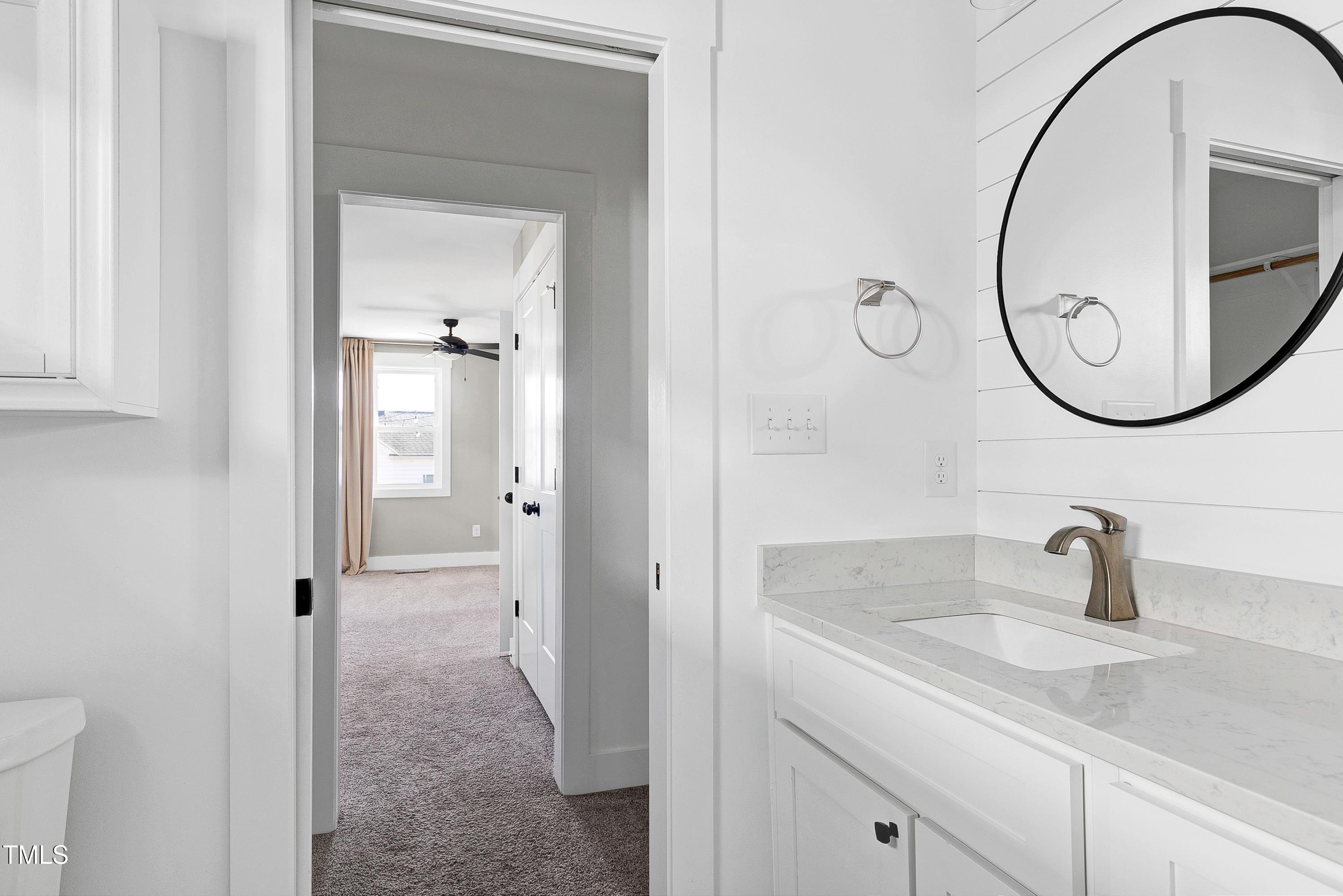 621 Coleman Street Raleigh, NC 27610 - Photo 21 of 42 a bathroom with a sink and a mirror