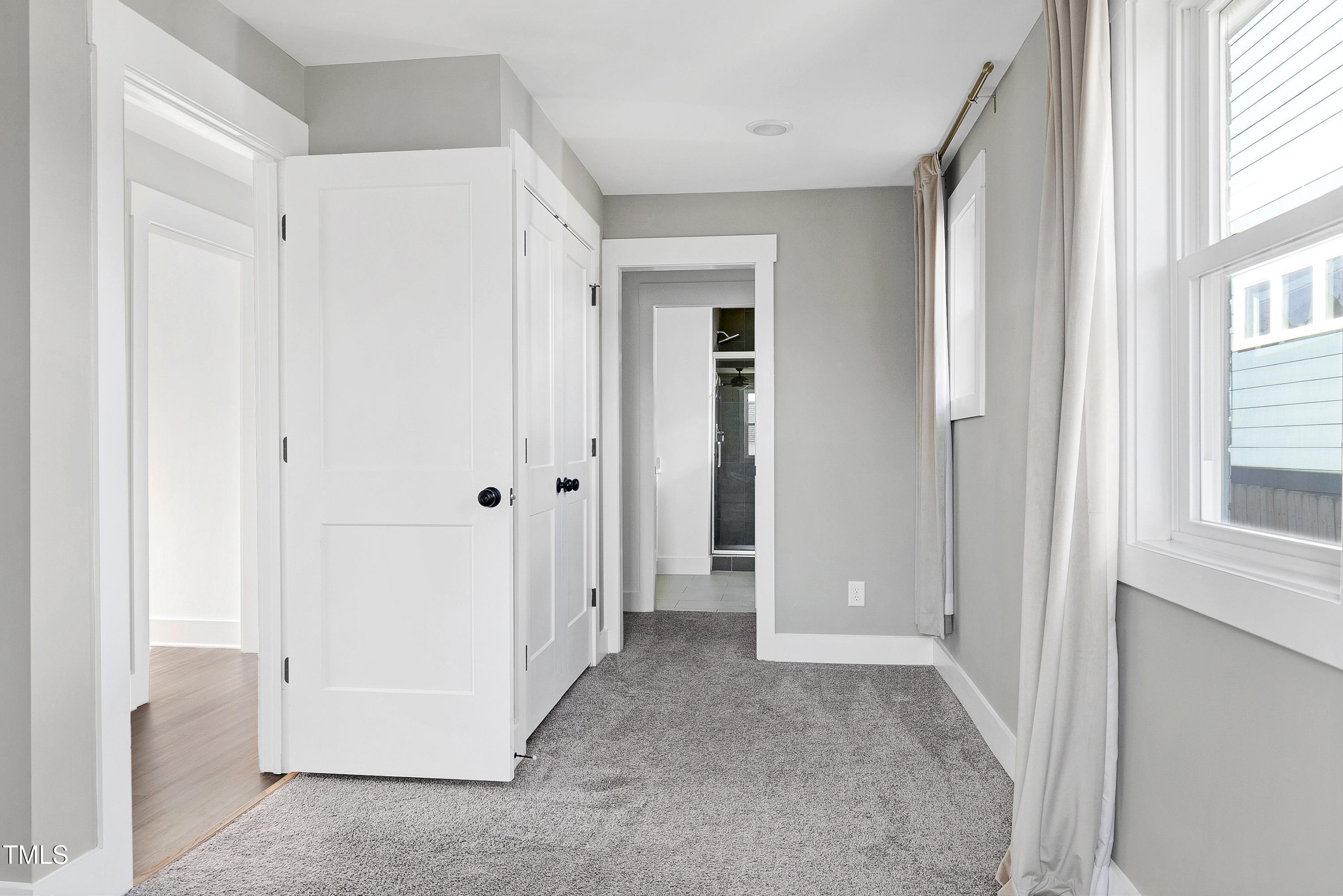 621 Coleman Street Raleigh, NC 27610 - Photo 22 of 42 a view of a hallway with closet and bathroom