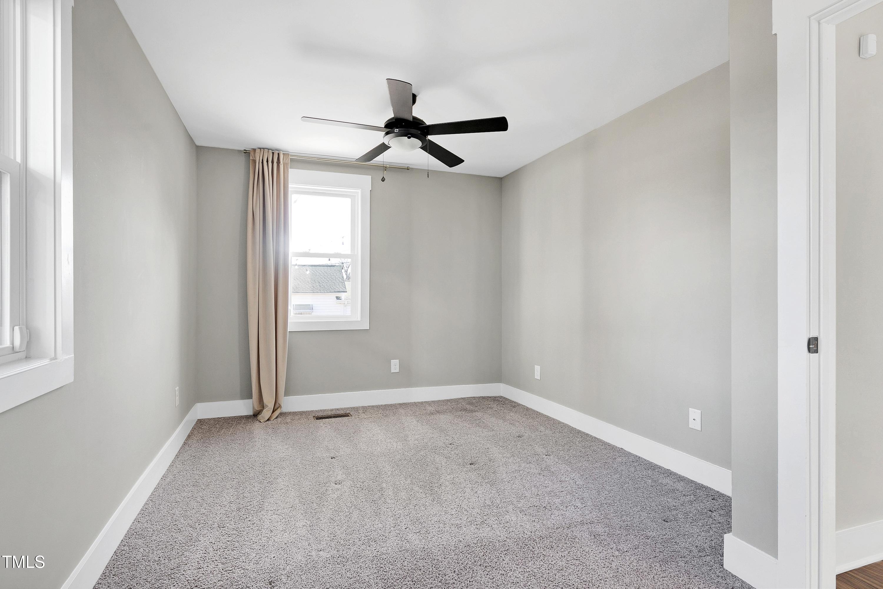 621 Coleman Street Raleigh, NC 27610 - Photo 23 of 42 a view of room with window and ceiling fan