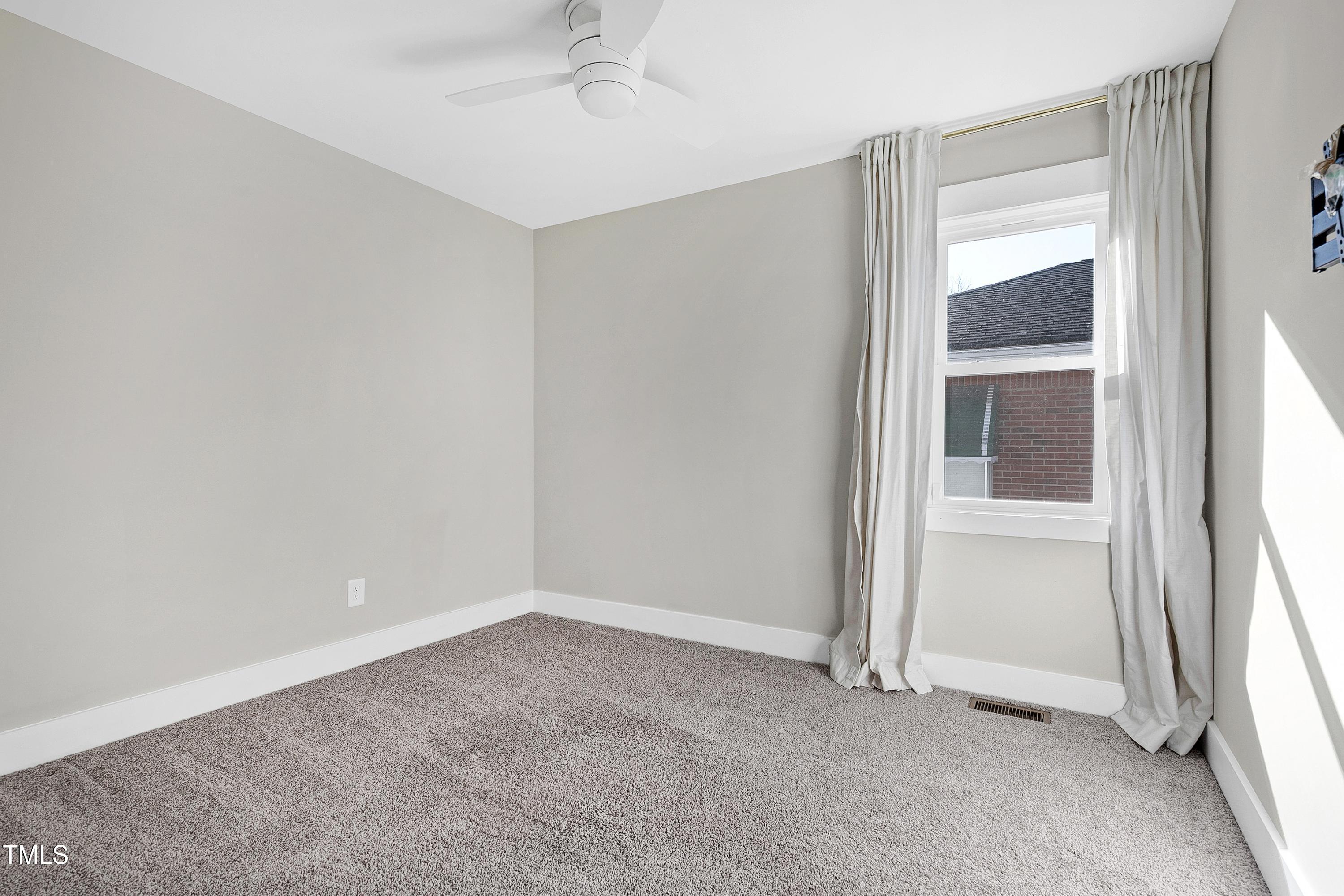 621 Coleman Street Raleigh, NC 27610 - Photo 26 of 42 an empty room with a empty space and windows
