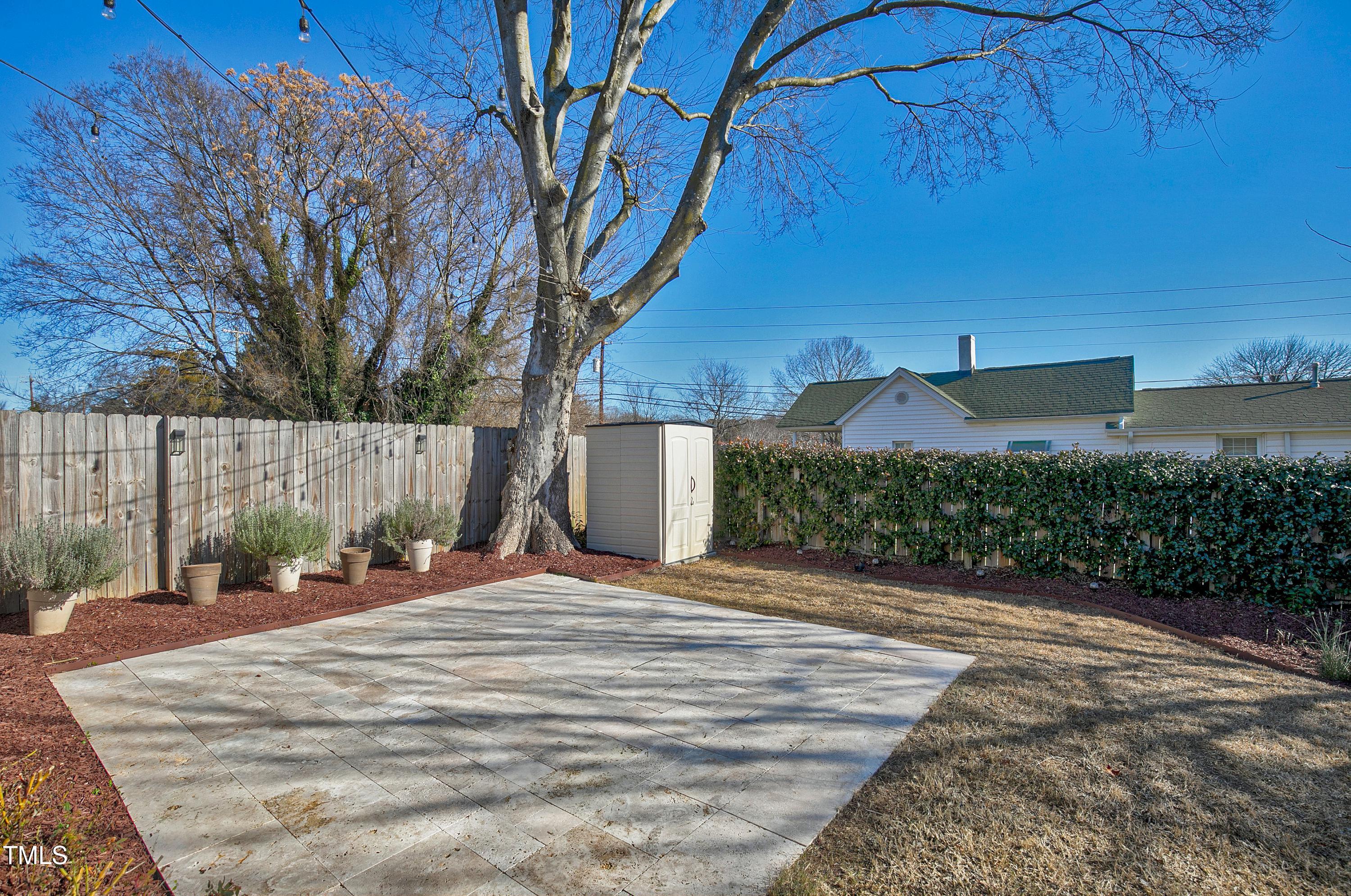 621 Coleman Street Raleigh, NC 27610 - Photo 35 of 42 a backyard of a house with plants and trees