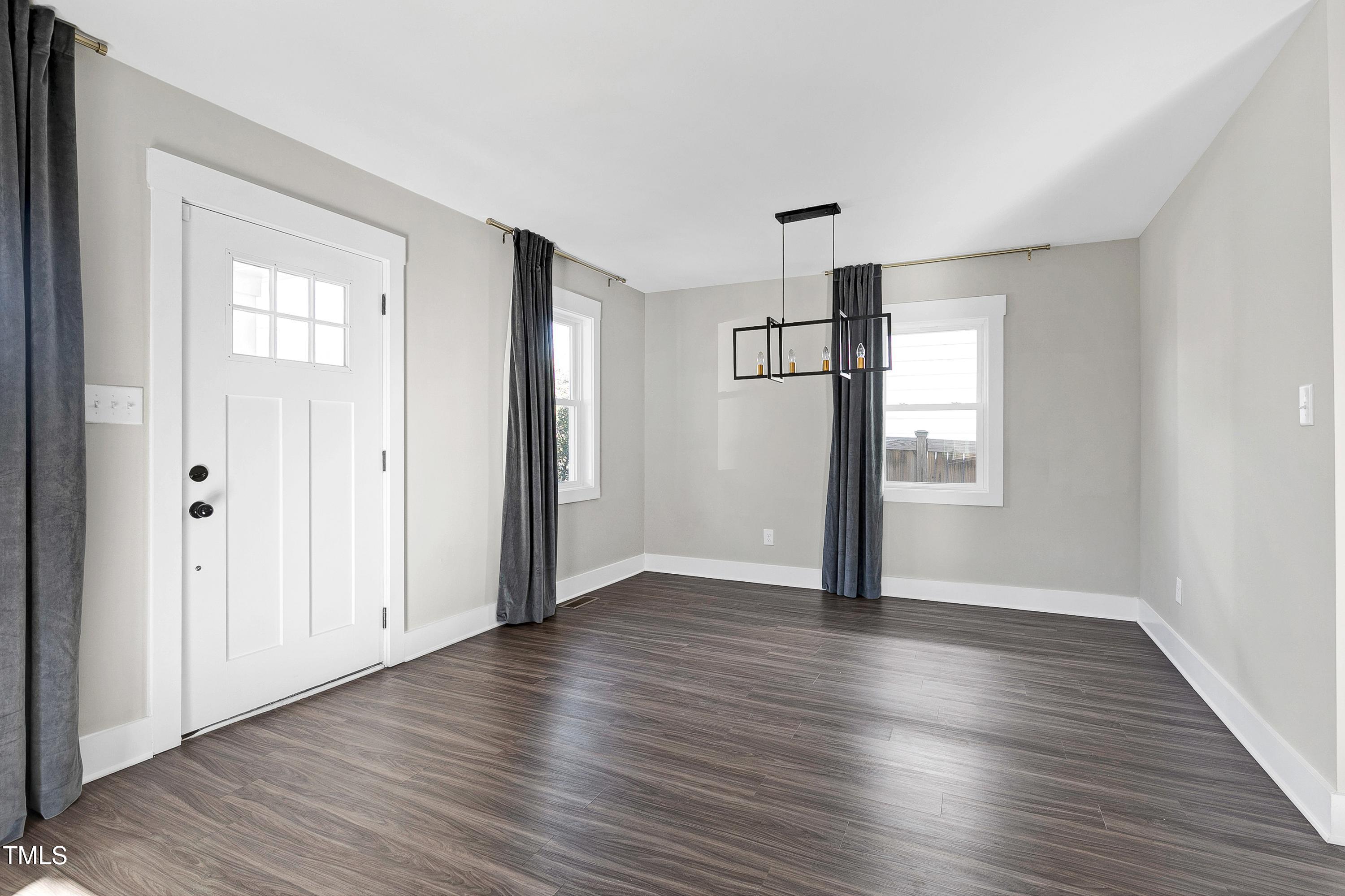 621 Coleman Street Raleigh, NC 27610 - Photo 8 of 42 a view of empty room with wooden floor