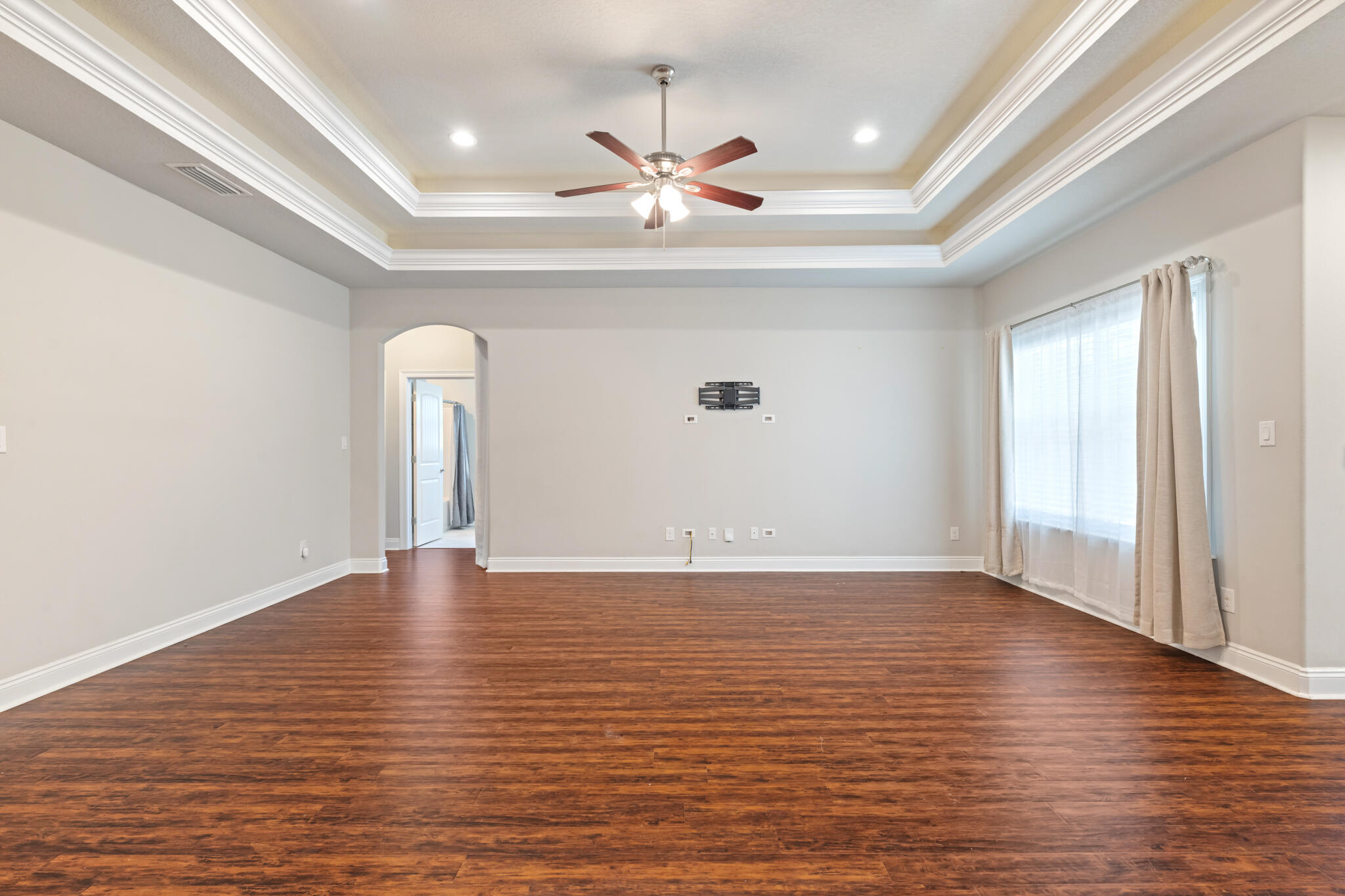 7287 Gordon Evans Road Navarre, FL 32566 - Photo 12 of 45 a view of an empty room with wooden floor and a window