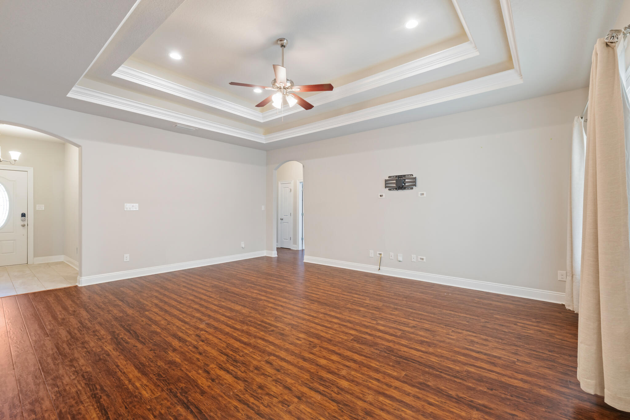7287 Gordon Evans Road Navarre, FL 32566 - Photo 13 of 45 a view of an empty room with wooden floor
