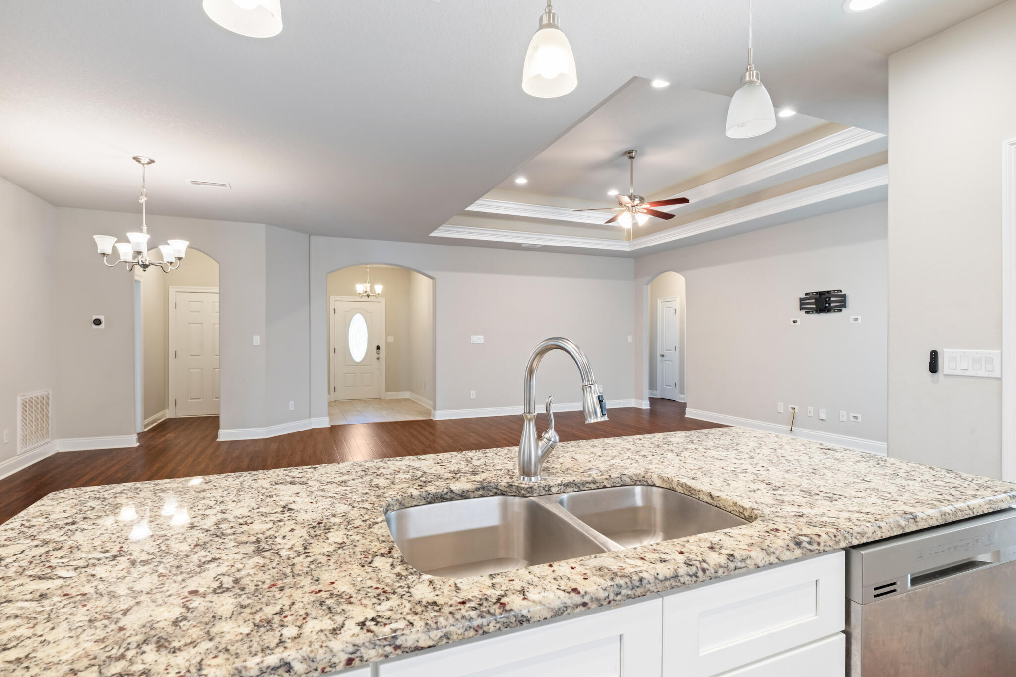 7287 Gordon Evans Road Navarre, FL 32566 - Photo 17 of 45 a kitchen with a sink and a chandelier