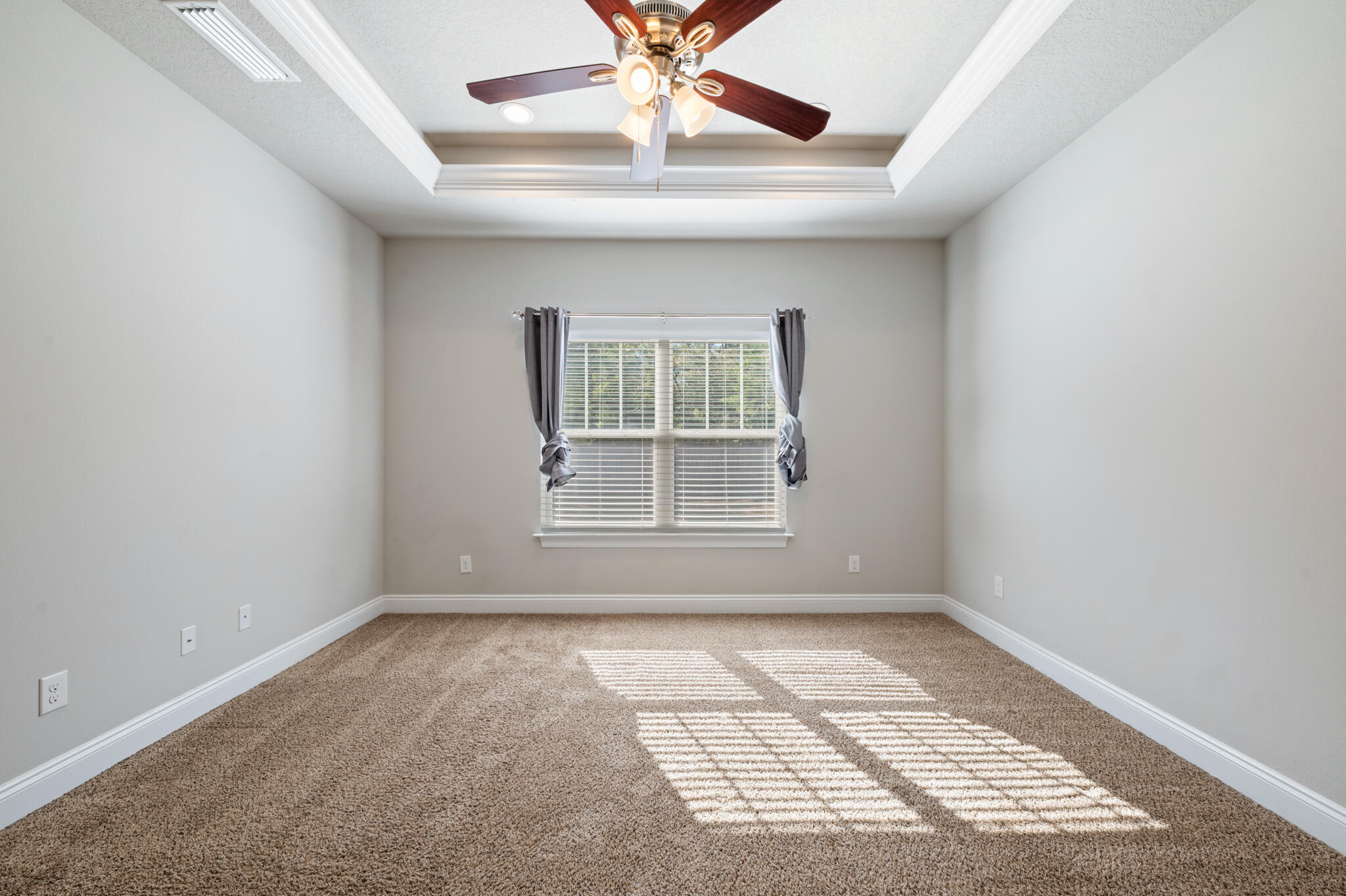 7287 Gordon Evans Road Navarre, FL 32566 - Photo 23 of 45 an empty room with a window and a ceiling fan