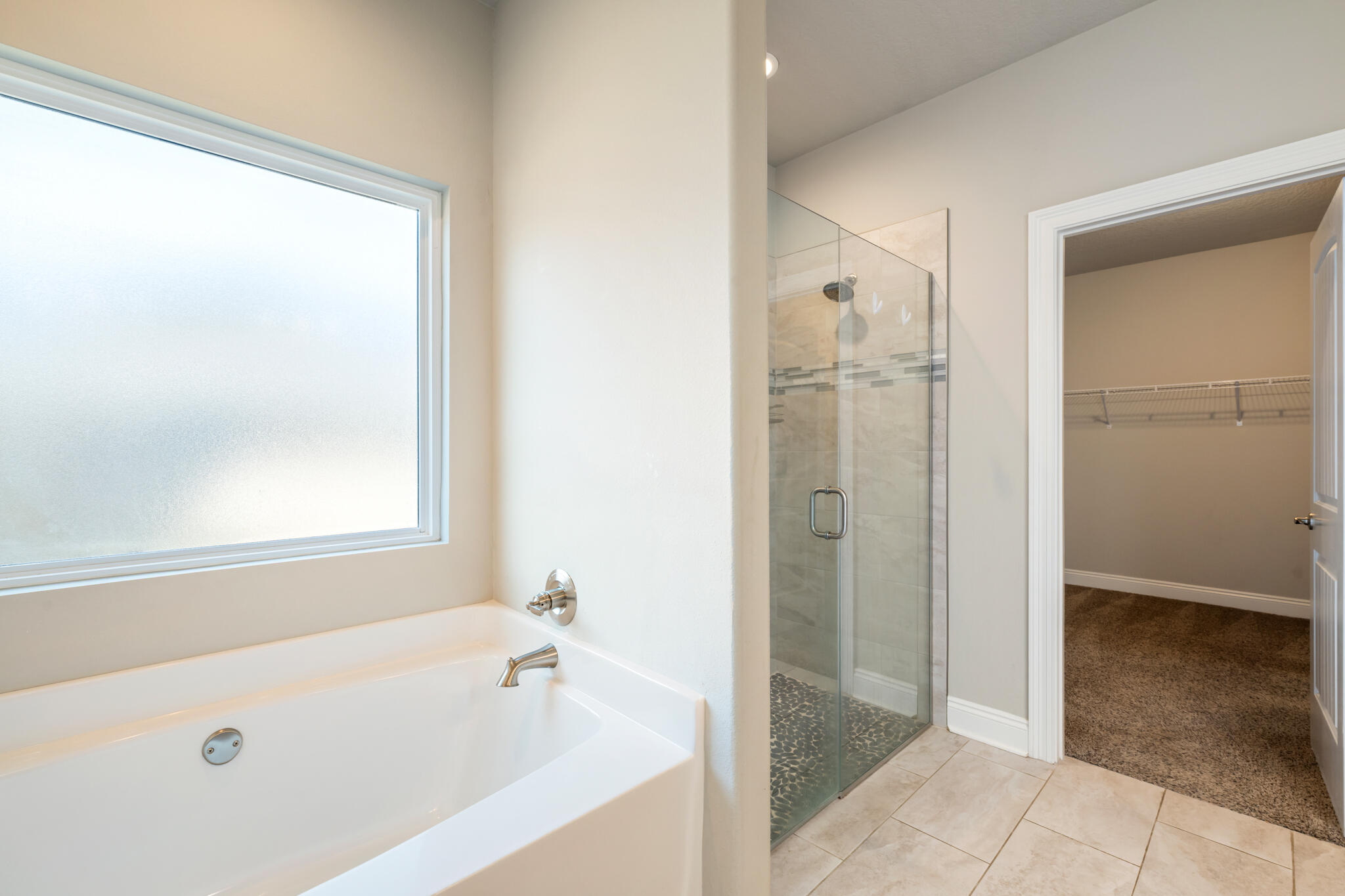 7287 Gordon Evans Road Navarre, FL 32566 - Photo 26 of 45 a bathroom with a bathtub and a shower