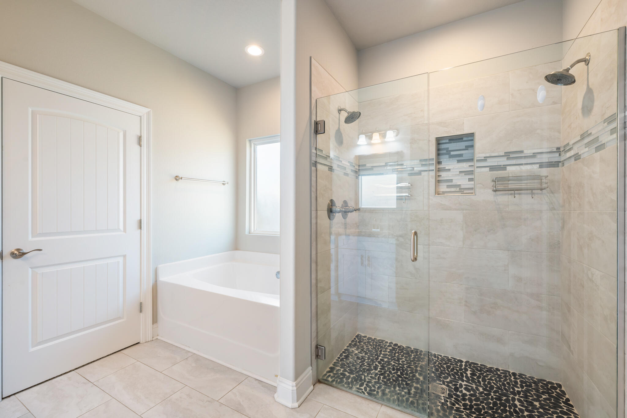 7287 Gordon Evans Road Navarre, FL 32566 - Photo 27 of 45 a bathroom with a bathtub and a shower