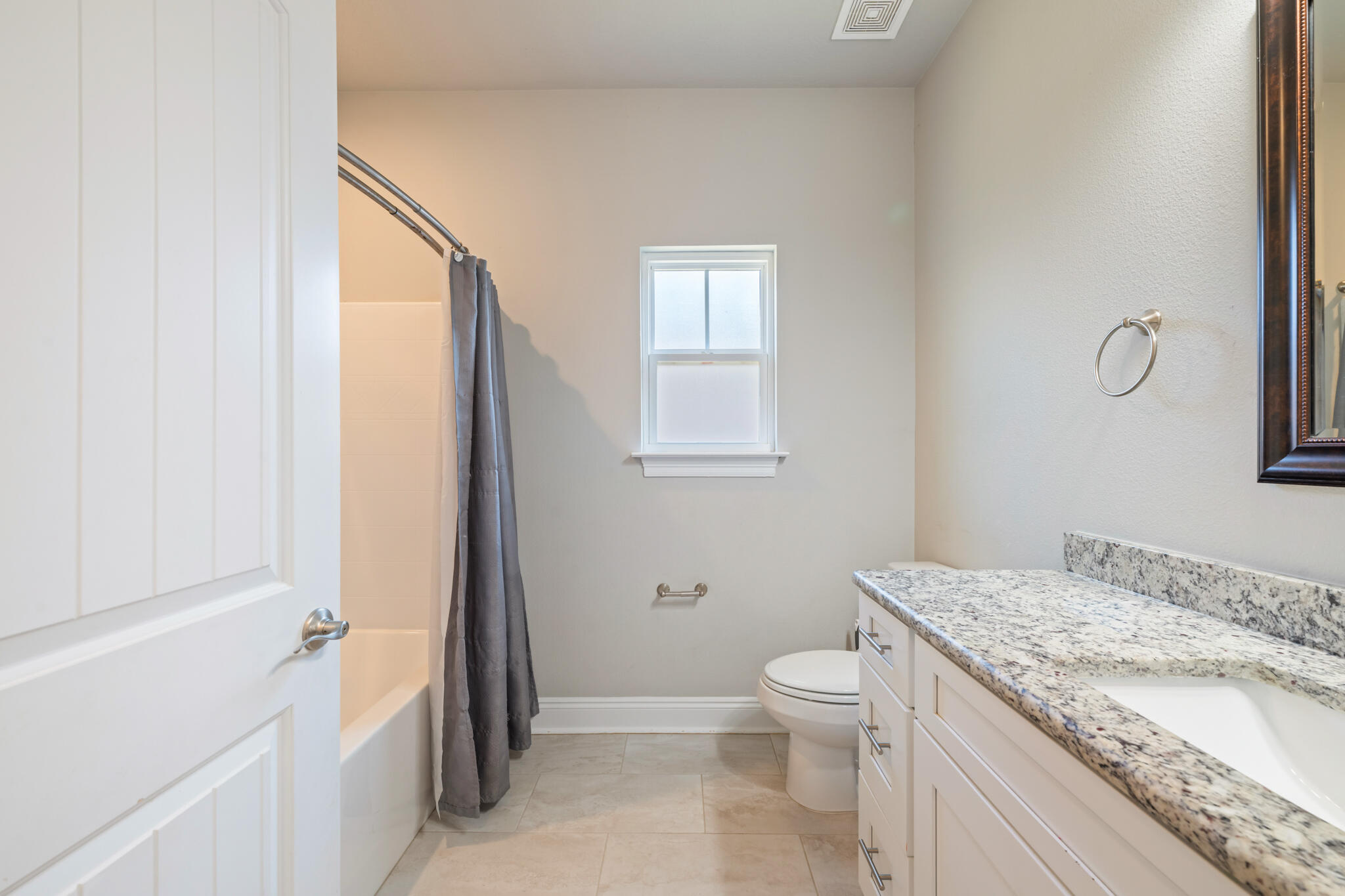 7287 Gordon Evans Road Navarre, FL 32566 - Photo 34 of 45 a bathroom with a granite countertop sink toilet and shower