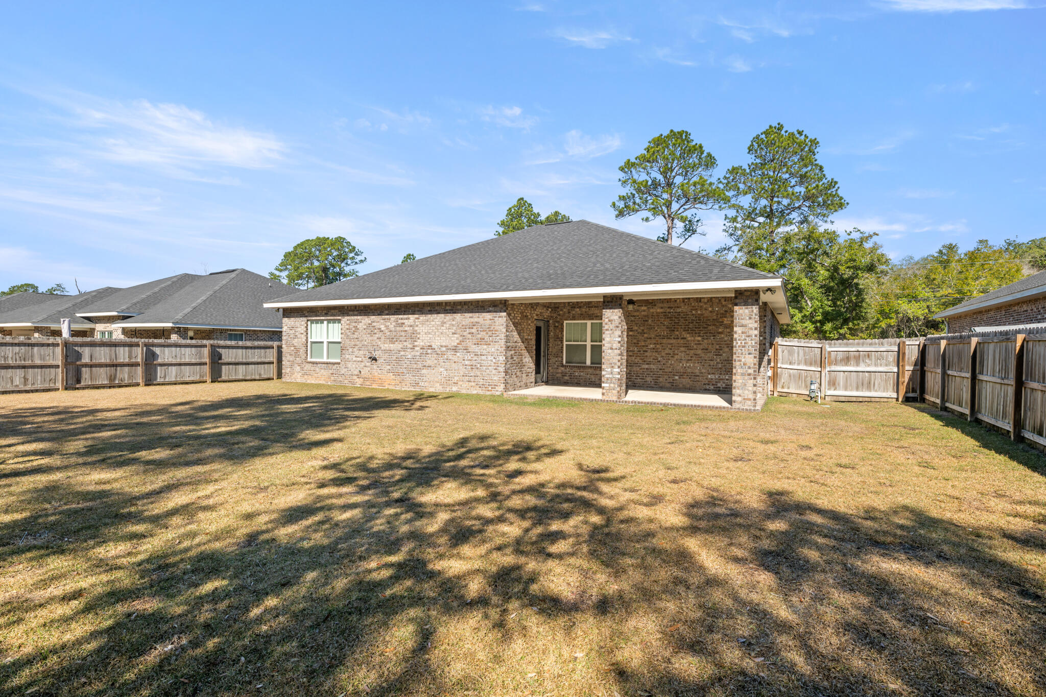 7287 Gordon Evans Road Navarre, FL 32566 - Photo 42 of 45 a house with a yard