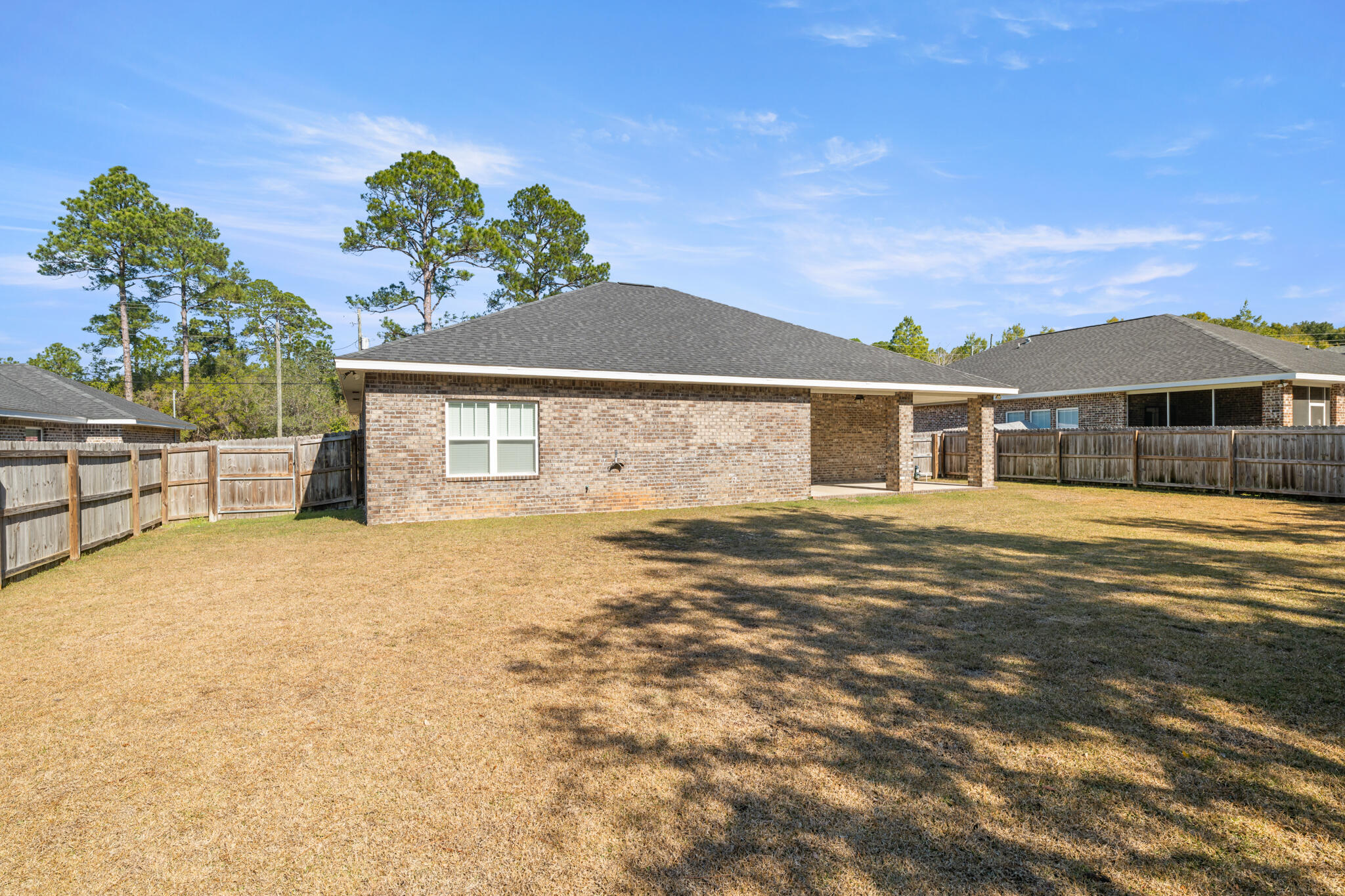 7287 Gordon Evans Road Navarre, FL 32566 - Photo 43 of 45 a front view of a house with a yard