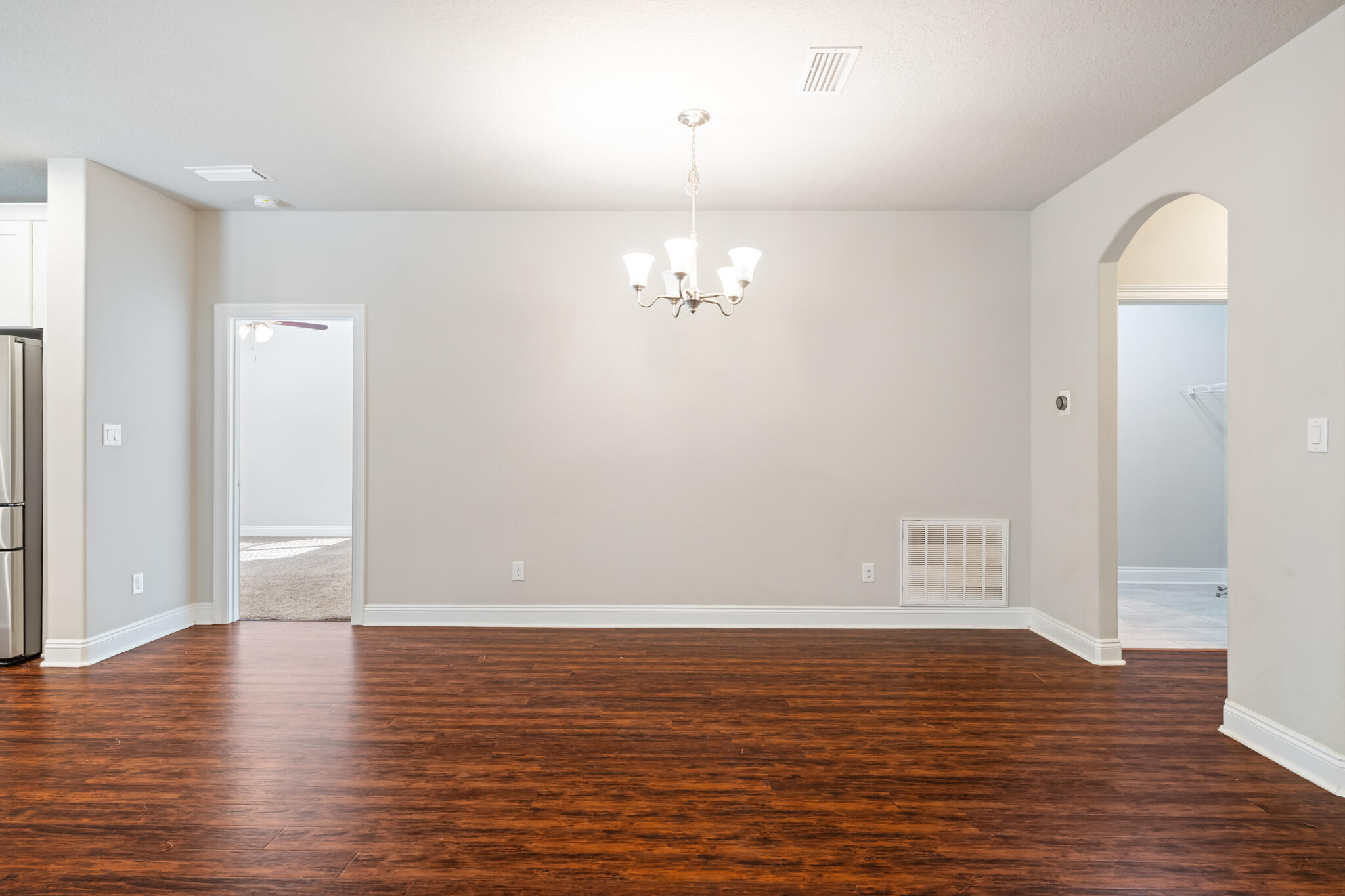 7287 Gordon Evans Road Navarre, FL 32566 - Photo 8 of 45 a view of a room with wooden floor