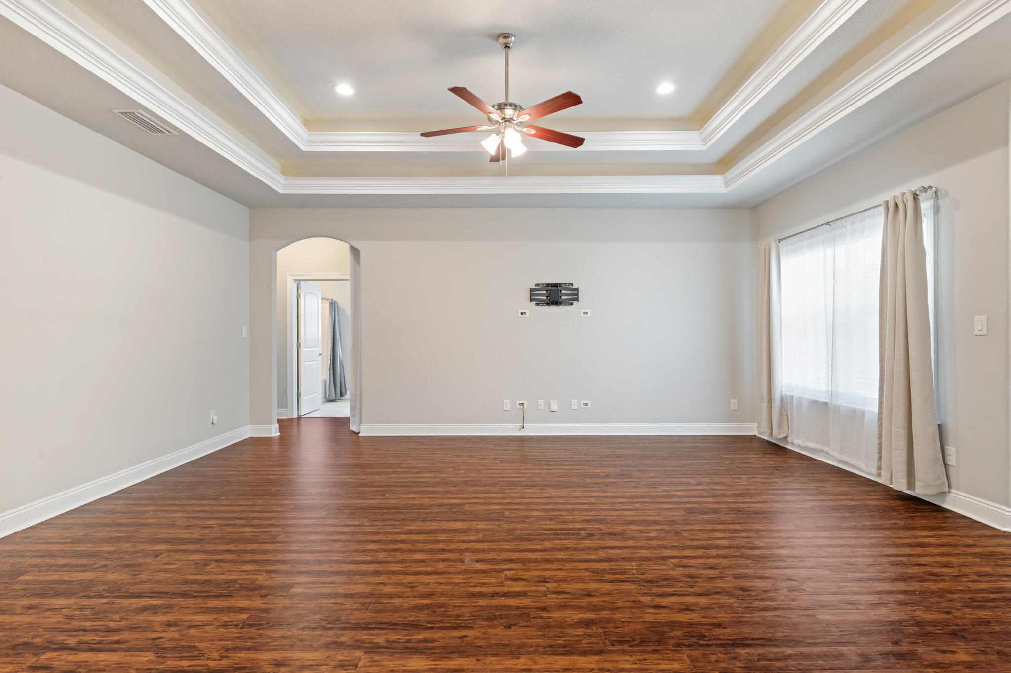 7287 Gordon Evans Road Navarre, FL 32566 - Photo 9 of 45 a view of an empty room with window and wooden floor