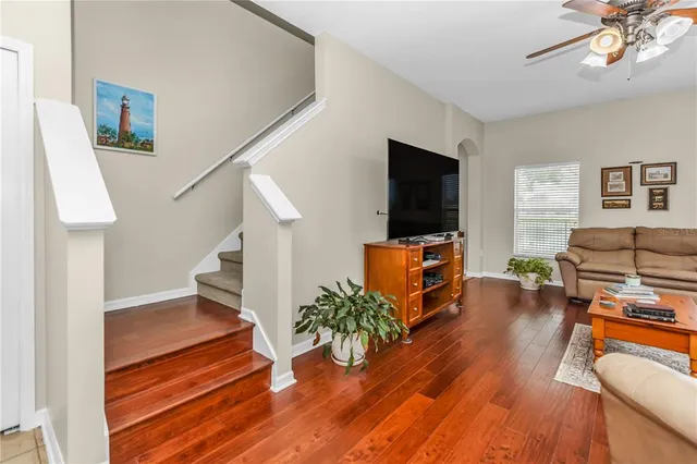 a living room with furniture and a flat screen tv