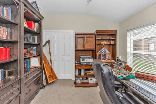 a view of a livingroom with furniture and toys