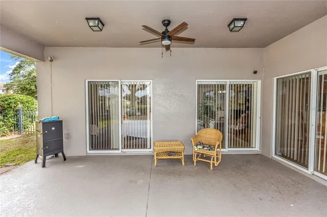 a balcony with table and chairs