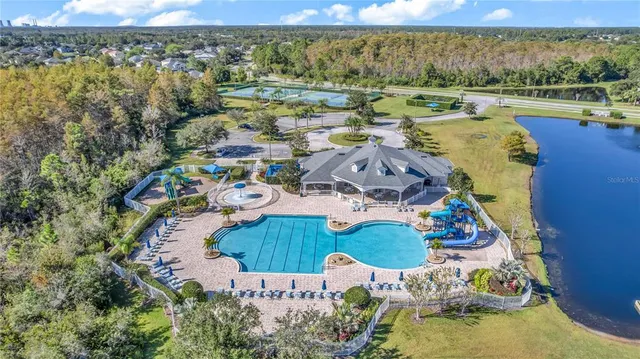 an aerial view of residential house with outdoor space and swimming pool