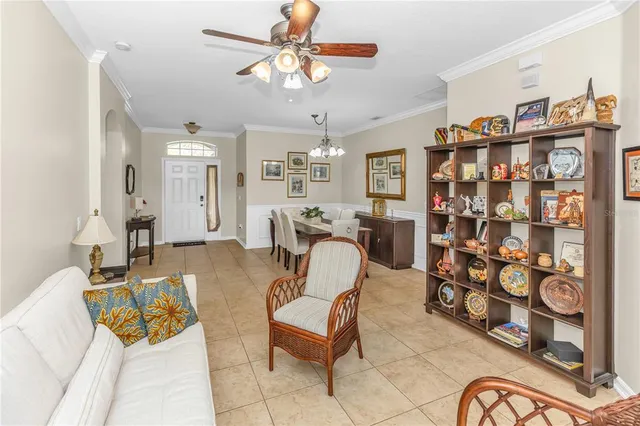 a living room with patio furniture and decor