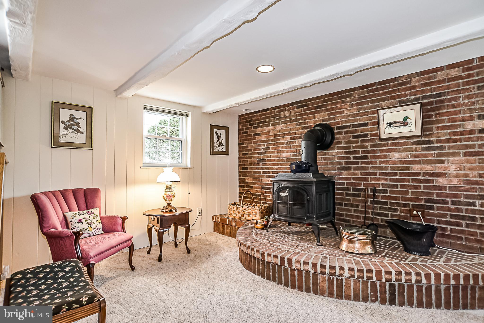 8605 Briarcroft Lane Laurel, MD 20708 - Photo 21 of 38 Cozy up to the wood stove on chilly nights.