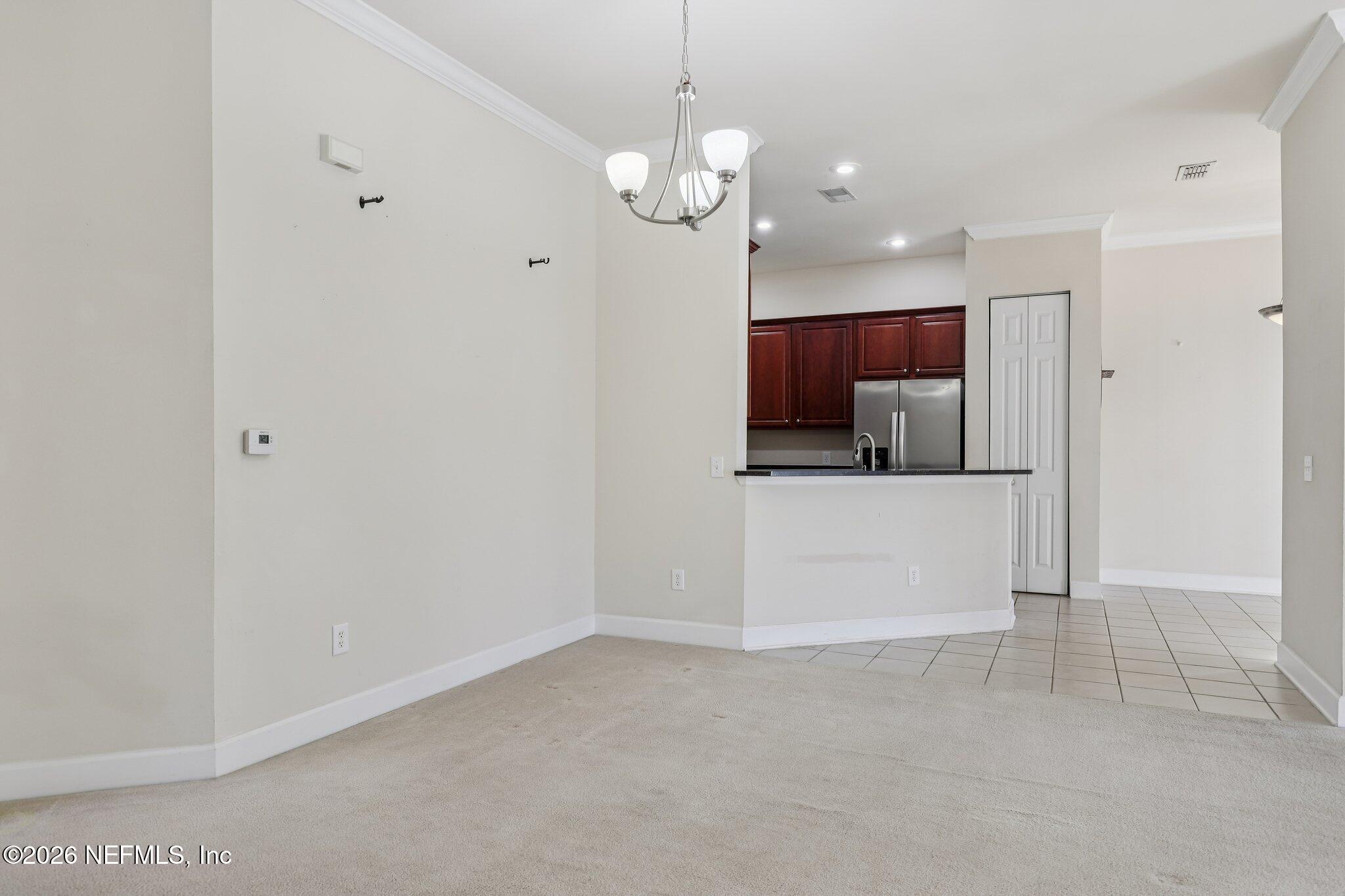 2035 Secret Garden Lane, Unit 505 Fleming Island, FL 32003 - Photo 11 of 47 a view of a kitchen with a sink and dishwasher