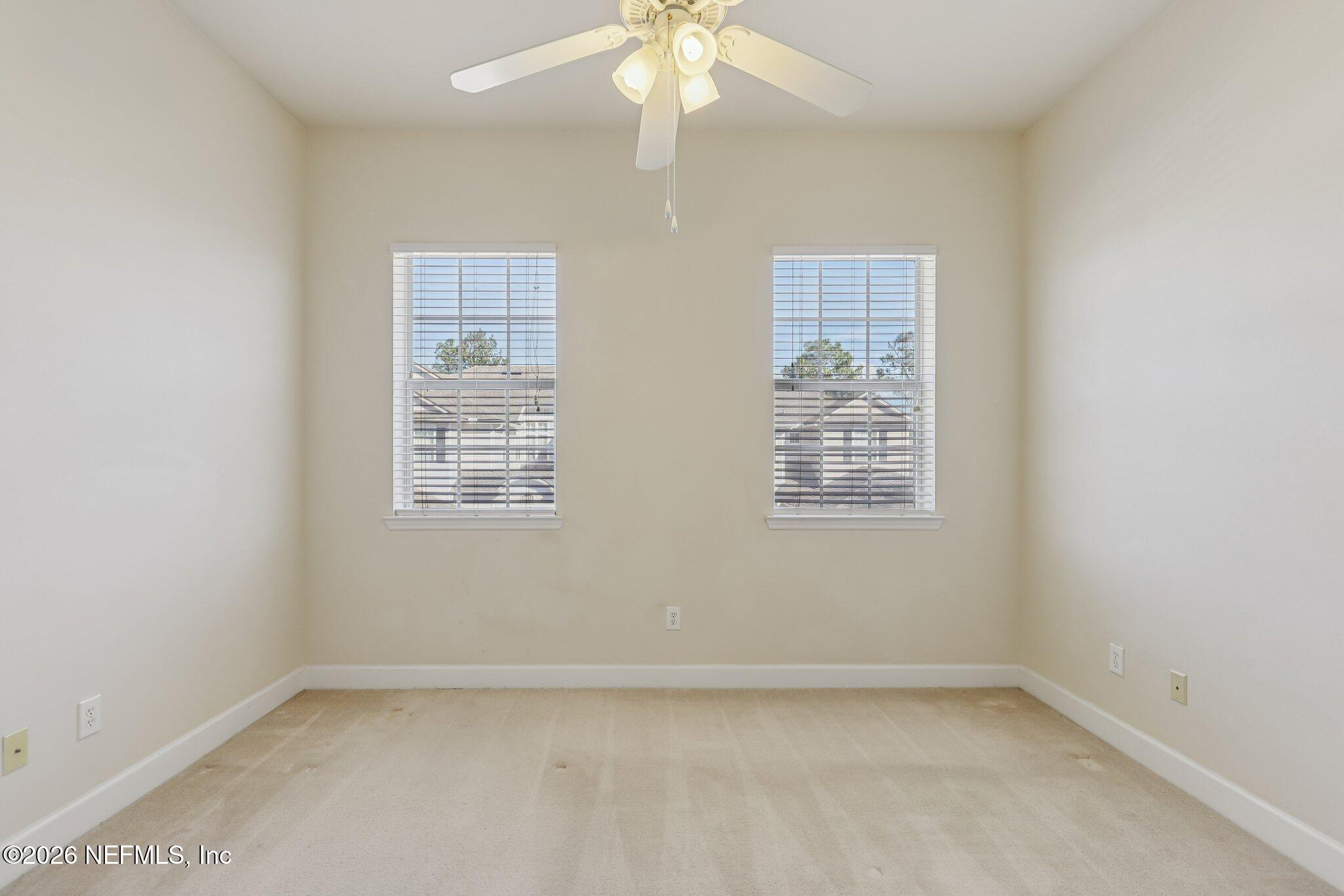 2035 Secret Garden Lane, Unit 505 Fleming Island, FL 32003 - Photo 16 of 47 an empty room with a window
