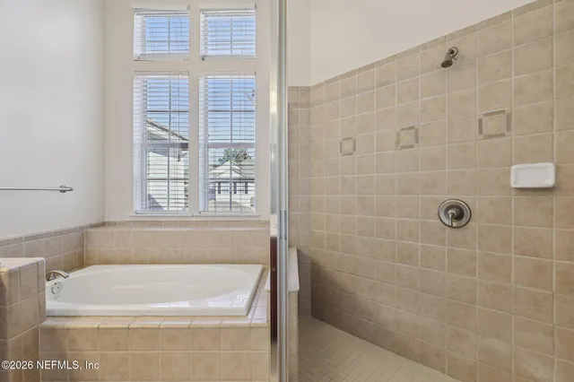 an aerial view of a house with garden space and street view